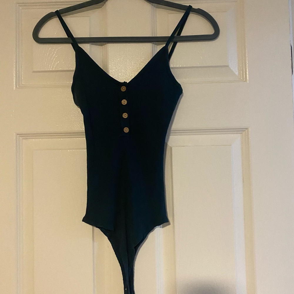 Green thong body suit